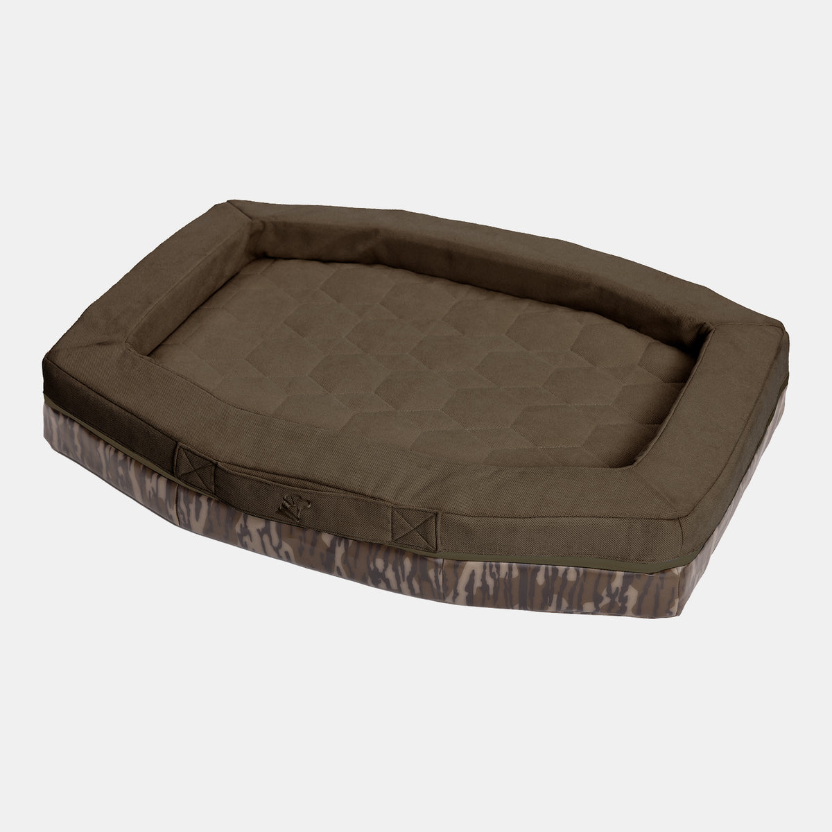 A rectangular brown cushioned CAMP BED by GUNNER, featuring raised edges and a subtle Mossy Oak Bottomland camo-patterned base, designed as a durable dog bed and shown on a plain white background.