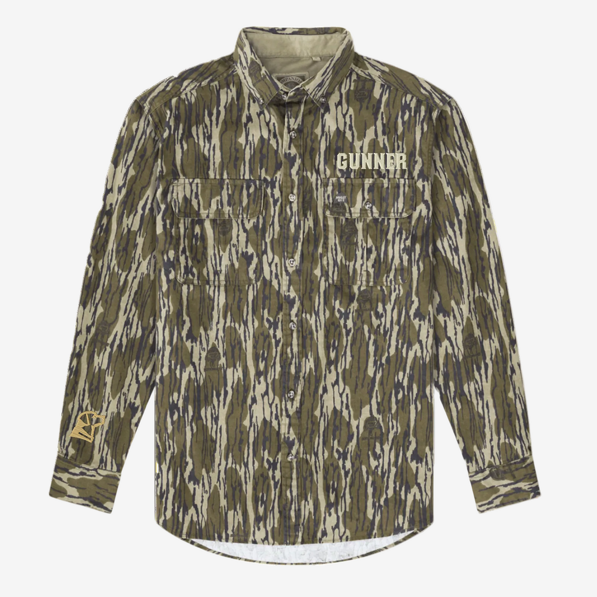 The GUNNER Late Season Long Sleeve Shirt in Mossy Oak OG Bottomland features two chest pockets, GUNNER text above the left pocket, and a yellow logo on the right sleeve.