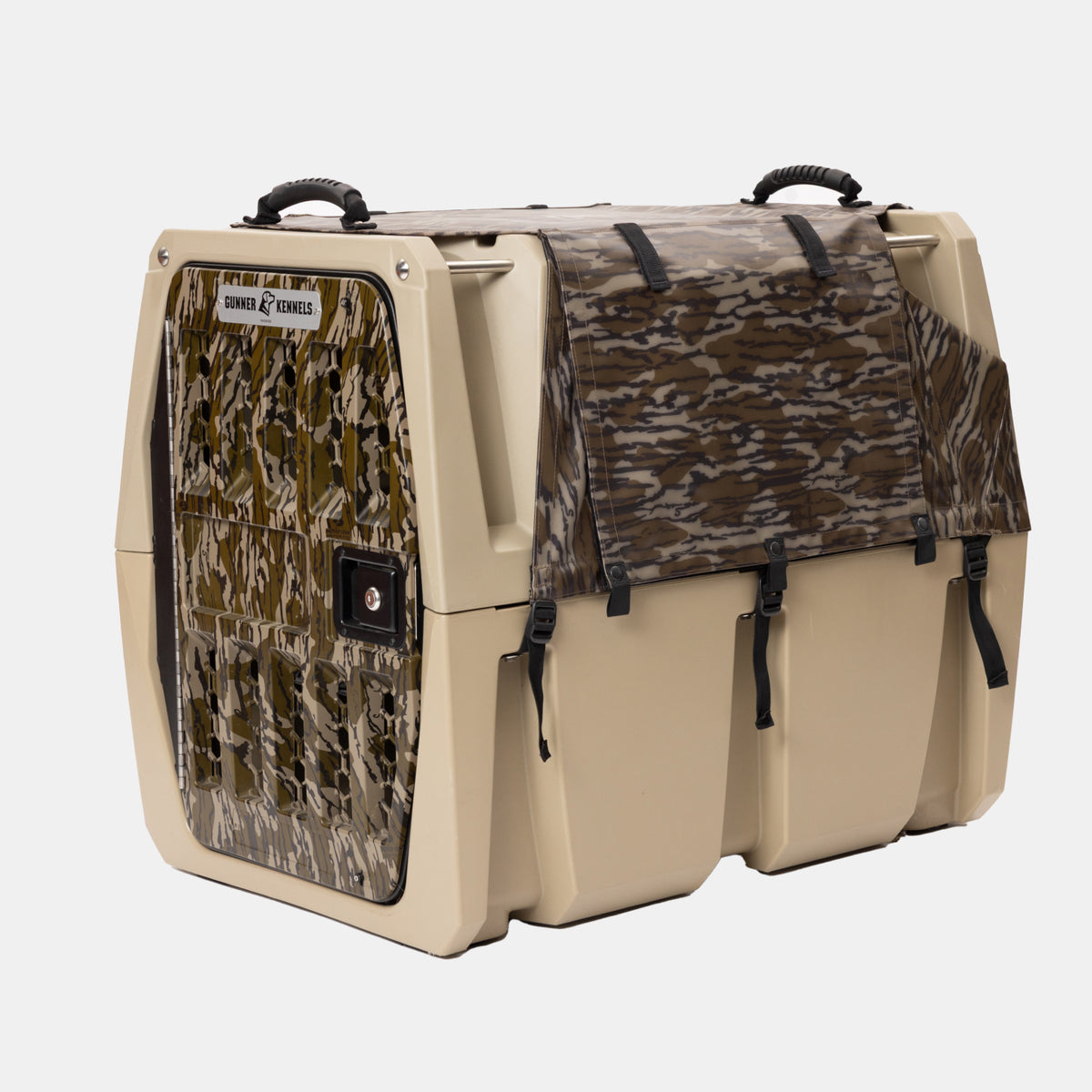 The GUNNER ALL-WEATHER KIT 2.0 MOSSY OAK BOTTOMLAND is a tan and camouflage portable pet kennel with a secure door and a matching Mossy Oak camouflage cover, featuring UV protection as part of its all-weather design for safe transport.
