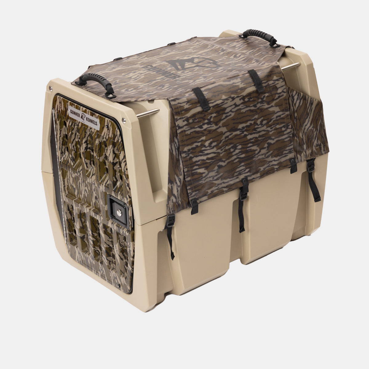The GUNNER ALL-WEATHER KIT 2.0 MOSSY OAK BOTTOMLAND features a tan hard-sided pet crate with a Mossy Oak Bottomland camouflage-patterned door, a waterproof cover with UV protection, black handles, and a latched door—shown on a white background, it’s the perfect all-weather solution for your pet.