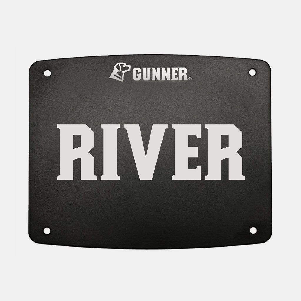 A black rectangular FOOD CRATE NAME PLATE from GUNNER, featuring the word RIVER in bold white letters with the GUNNER logo displayed above. The plate includes four corner holes for convenient mounting, allowing easy personalization of your GUNNER Food Crate.