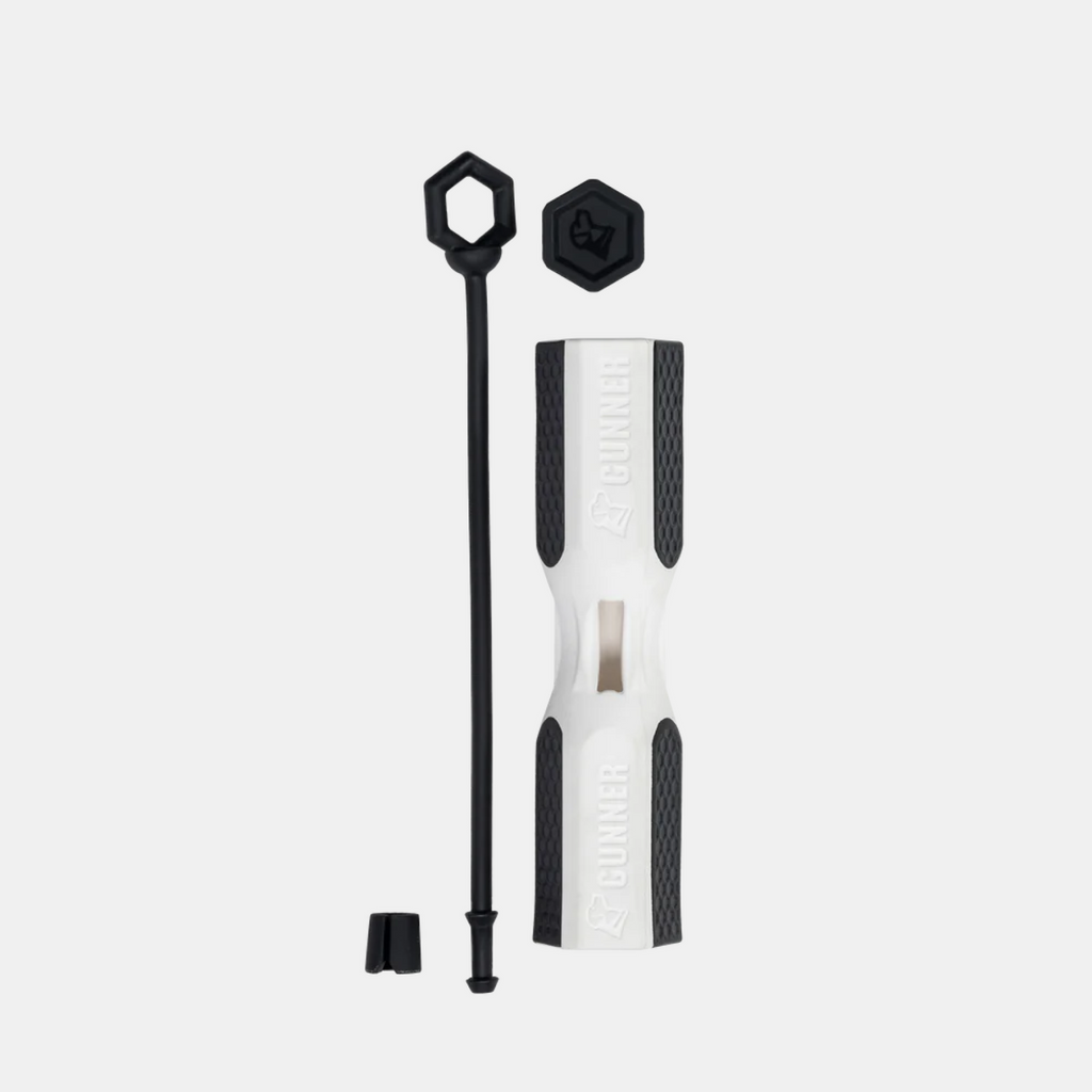 A white and black cylindrical tool labeled GUNNER—reminiscent of gear found in a premium dog kennel—features a rectangular window, long black rod, two hexagonal caps, and a small black piece, all set on a white background.