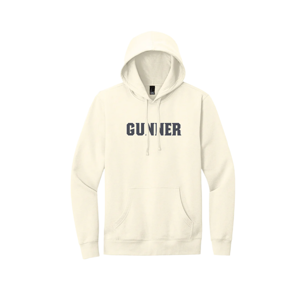 The GUNNER Hoodie by GUNNER is a cream fleece hoodie with bold GUNNER lettering on the chest, front pocket, and drawstrings—ideal for camp or chilly mornings.