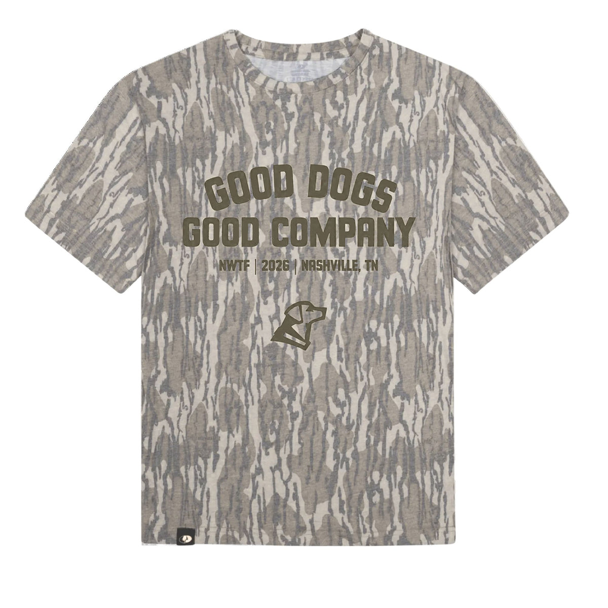The GUNNER Good Dogs, Good Tees is a gray camouflage t-shirt in the classic Mossy Oak Bottomland pattern, featuring “GOOD DOGS GOOD COMPANY NWTF 2026 NASHVILLE, TN” printed in dark letters and a dog graphic at the center.
