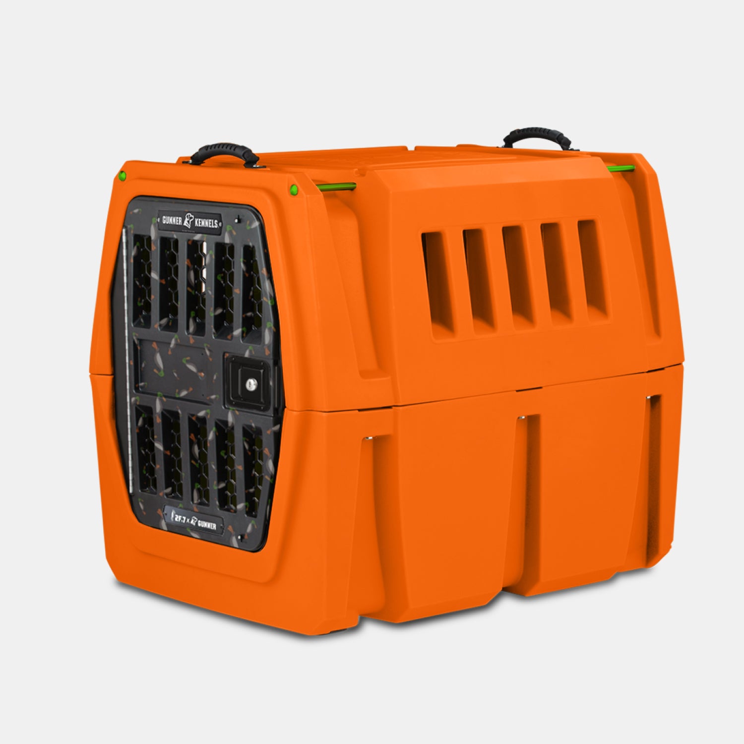 The GUNNER G1™ KENNEL - 2F.7 ORANGE CRUSH is a hard-sided orange pet carrier with double-walled protection, ventilation slots, a grated door, and black top handles—providing one of the safest ways to transport your dog.