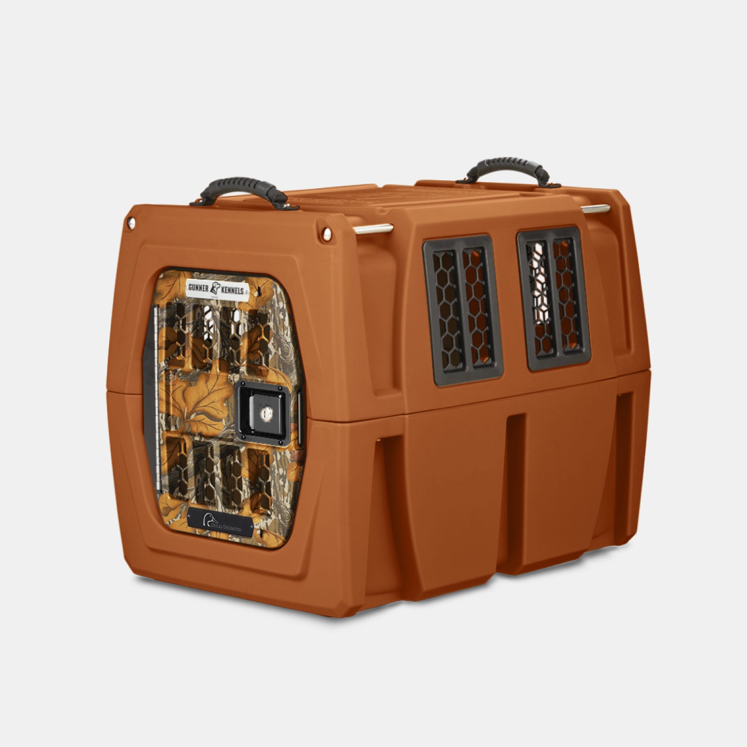 The GUNNER G1™ KENNEL - Habitat Edition is a sturdy, brown plastic pet crate with ventilation windows, a camo-patterned door, and top handles—ideal for dog kennels or outdoor trips inspired by Ducks Unlimited.
