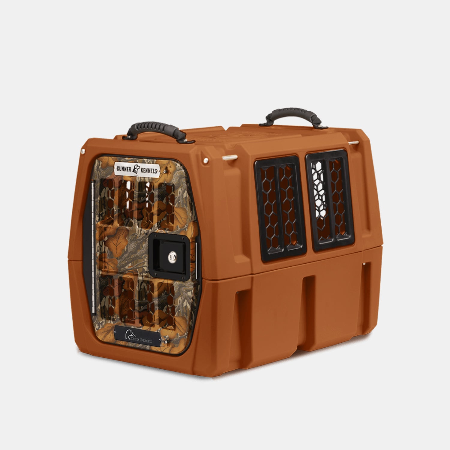 The GUNNER G1™ KENNEL - Habitat Edition is a durable brown pet crate with camouflage metal door, two black-vented side windows, and top black handles—ideal for dog kennels and inspired by Ducks Unlimited’s waterfowl conservation efforts.