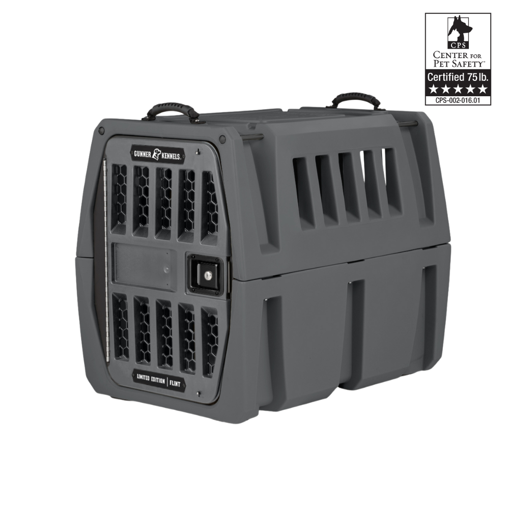 The GUNNER G1™ Kennel - Flint is a sturdy, dark gray, double-walled crate with ventilation slats, secure metal door, top handles, CPS certification for pets up to 75 lbs, and superior shock protection.
