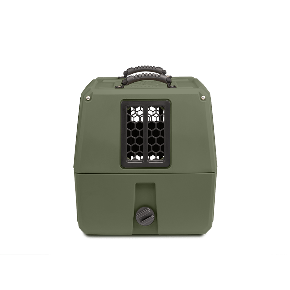 The GUNNER G1™ KENNEL in Gunner Green is a double-walled hard-shell pet carrier, featuring a black top handle, front mesh window, and round bottom latch. The product is displayed on a white background.