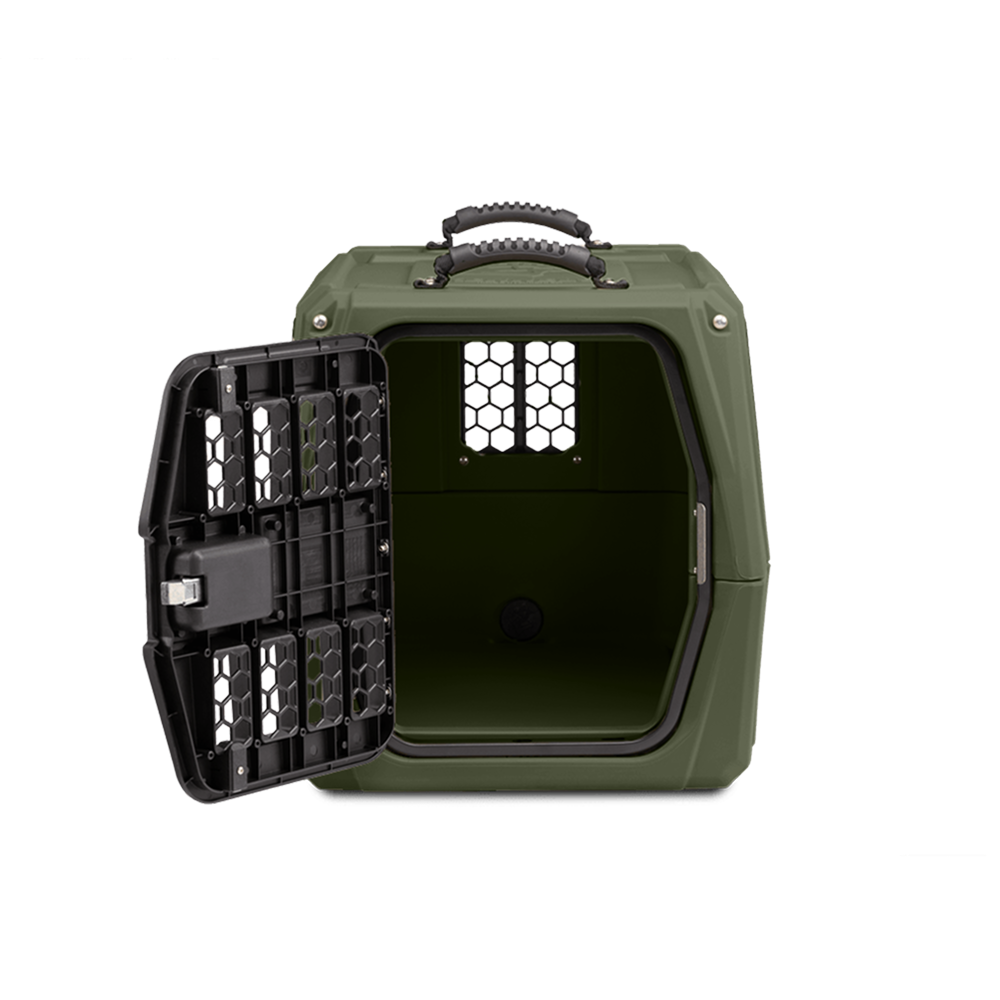 The GUNNER G1™ KENNEL in Gunner Green features a double-walled design, black open metal door, ventilation holes, and sturdy top handle, shown against a plain white background.