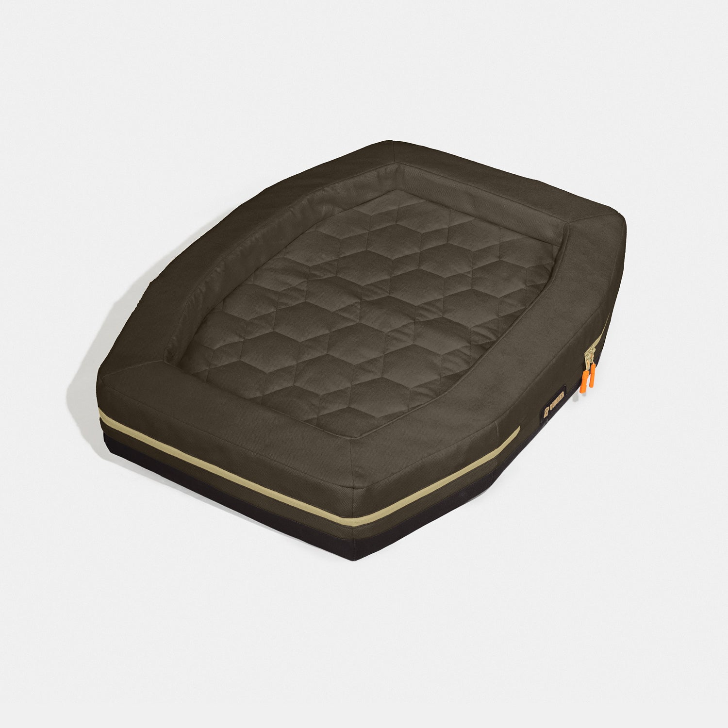 The GUNNER HOMESTEAD DOG BED in Special-Edition Pheasant Brown features a rectangular, quilted design with raised edges, hexagon-patterned sleeping surface, and orange zipper pulls—supporting Pheasants Forever with durable outdoor style.