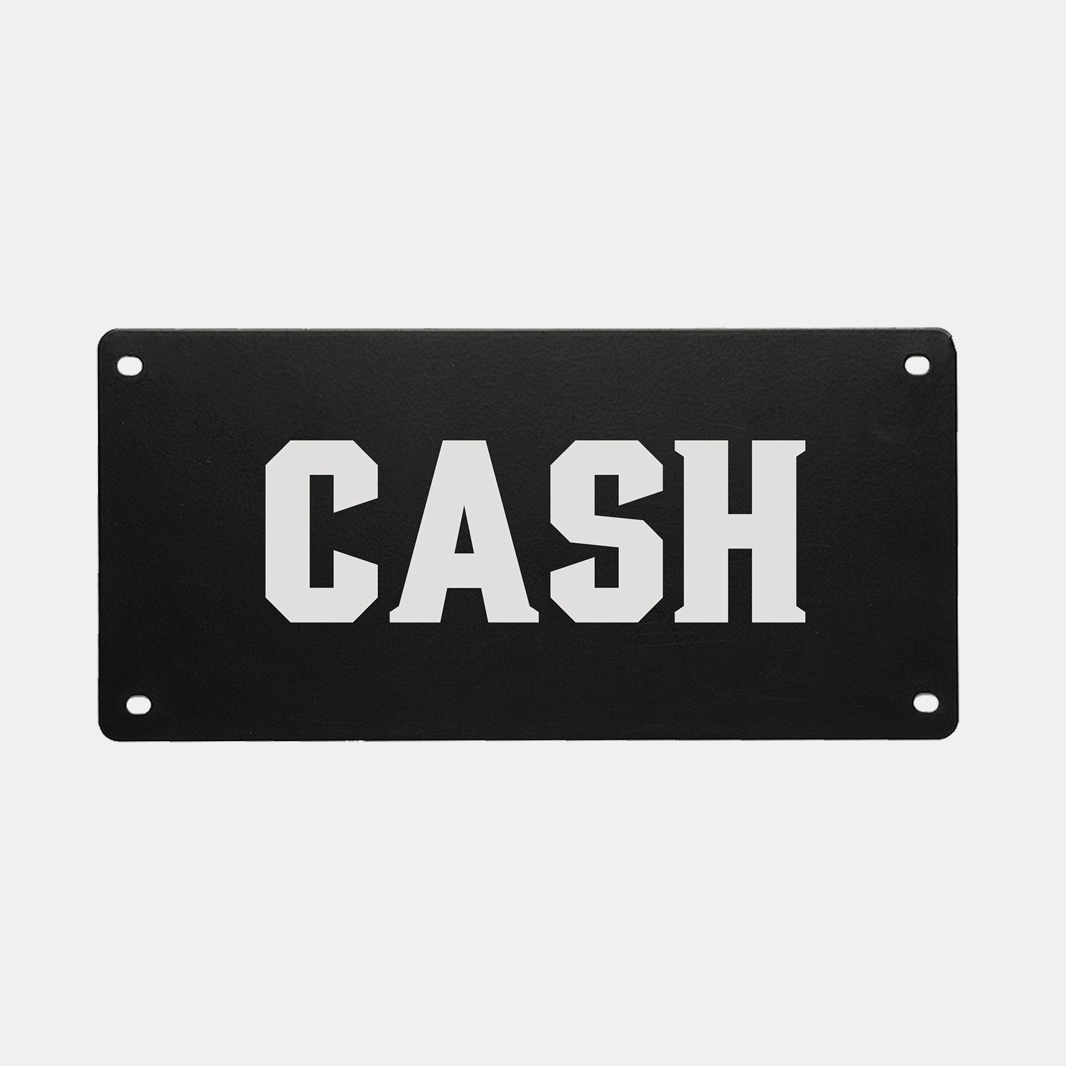 A black rectangular PERSONALIZED KENNEL NAME PLATE from GUNNER featuring the word CASH in bold, white, uppercase letters. Four pre-drilled holes—one in each corner—make this name plate easy to mount, making it a perfect custom touch for your GUNNER dog crate.