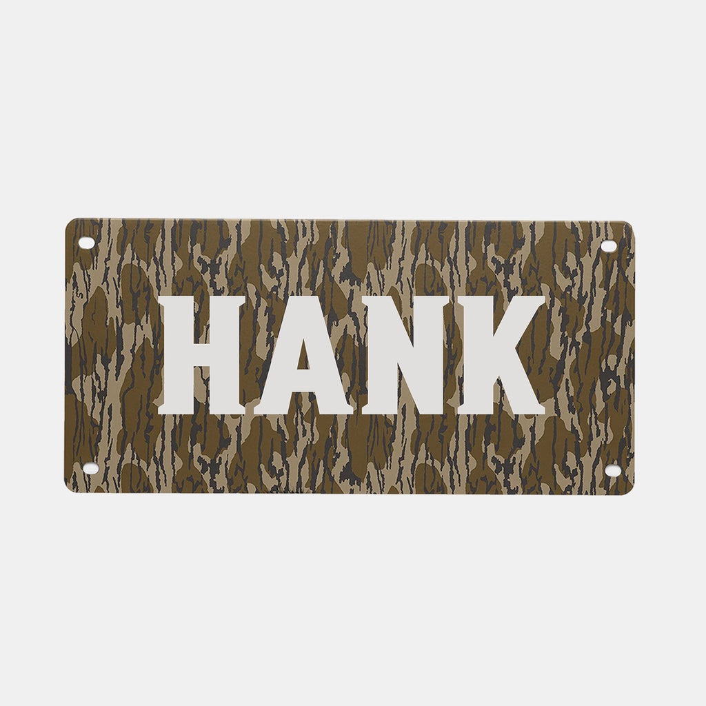 Add a personalized touch to your custom dog crate or GUNNER crate with the GUNNER PERSONALIZED KENNEL NAME PLATE—a rectangular sign showcasing a brown and green camouflage pattern and your chosen name in large, bold, white capital letters.