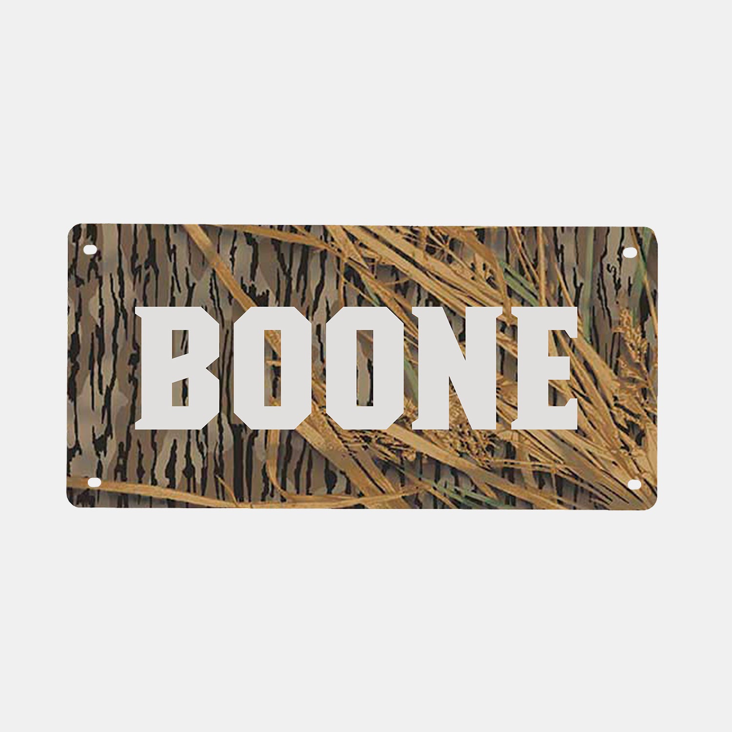 A GUNNER PERSONALIZED KENNEL NAME PLATE featuring a camouflage background and your chosen text—like “BOONE” in bold, white letters—perfect for outdoor enthusiasts or for adding a custom touch to your dog’s GUNNER crate.