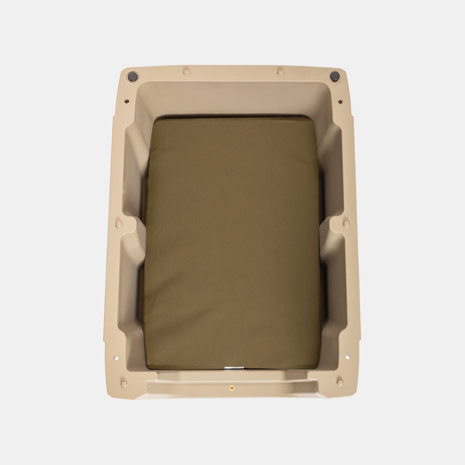 The GUNNER LONG HAUL BED is a tan rectangular plastic kennel bed with rounded corners and an olive green padded cushion, shown from above on a white background. Durable and easy to clean, its designed for lasting comfort for your dog.