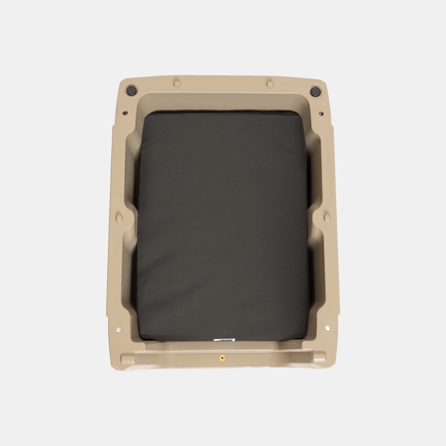 The GUNNER LONG HAUL BED features a rectangular tan plastic frame with a black padded cushion in the center, creating a durable dog bed, as seen from above on a plain white background.