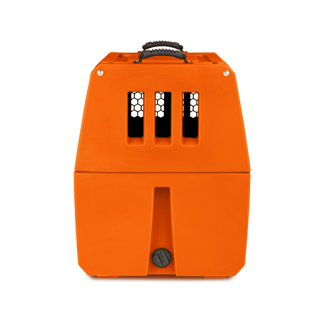 A bright orange plastic dog crate with three vertical ventilation slits and a black handle on top, shown against a plain white background.