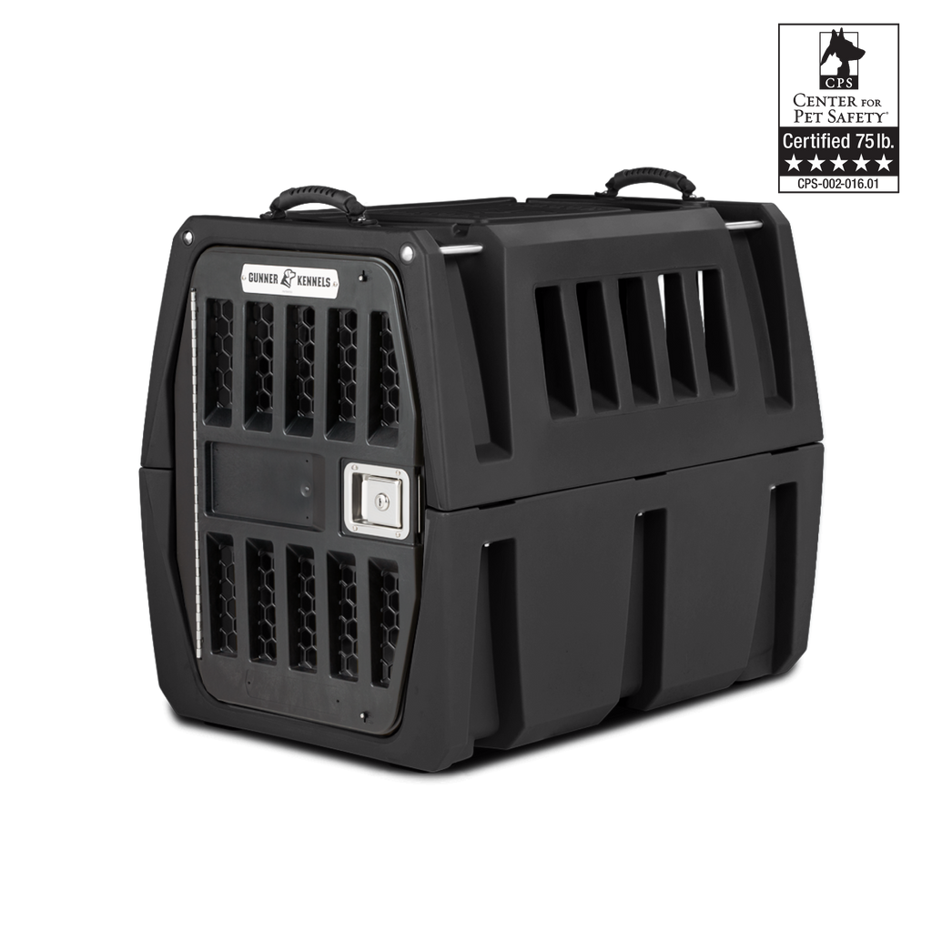 A sturdy black dog kennel with ventilation slats, secure latch door, and a handle on top. A Certified 75 lb. Center for Pet Safety label is visible in the top right corner of the image.